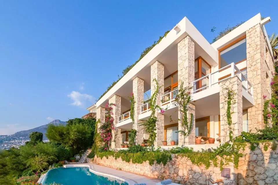 Hotel Villa Mahal cliffside infinity pool and sea platforms above Kalkan Bay, Turkey