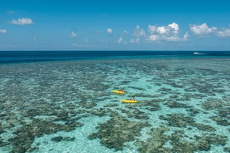 Luxury overwater villas in the Maldives above a turquoise lagoon